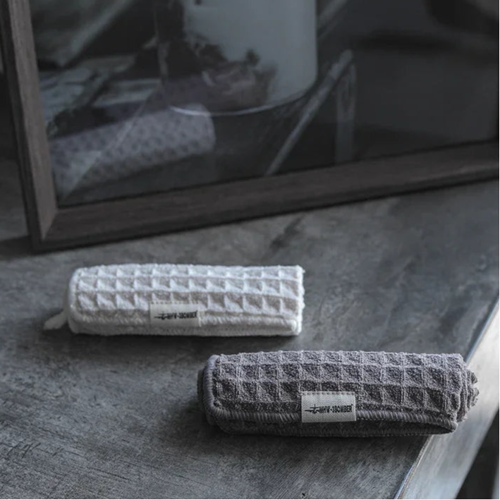 Rolled waffle-textured towels from Premium Coffee Bar for bar microfiber cleaning